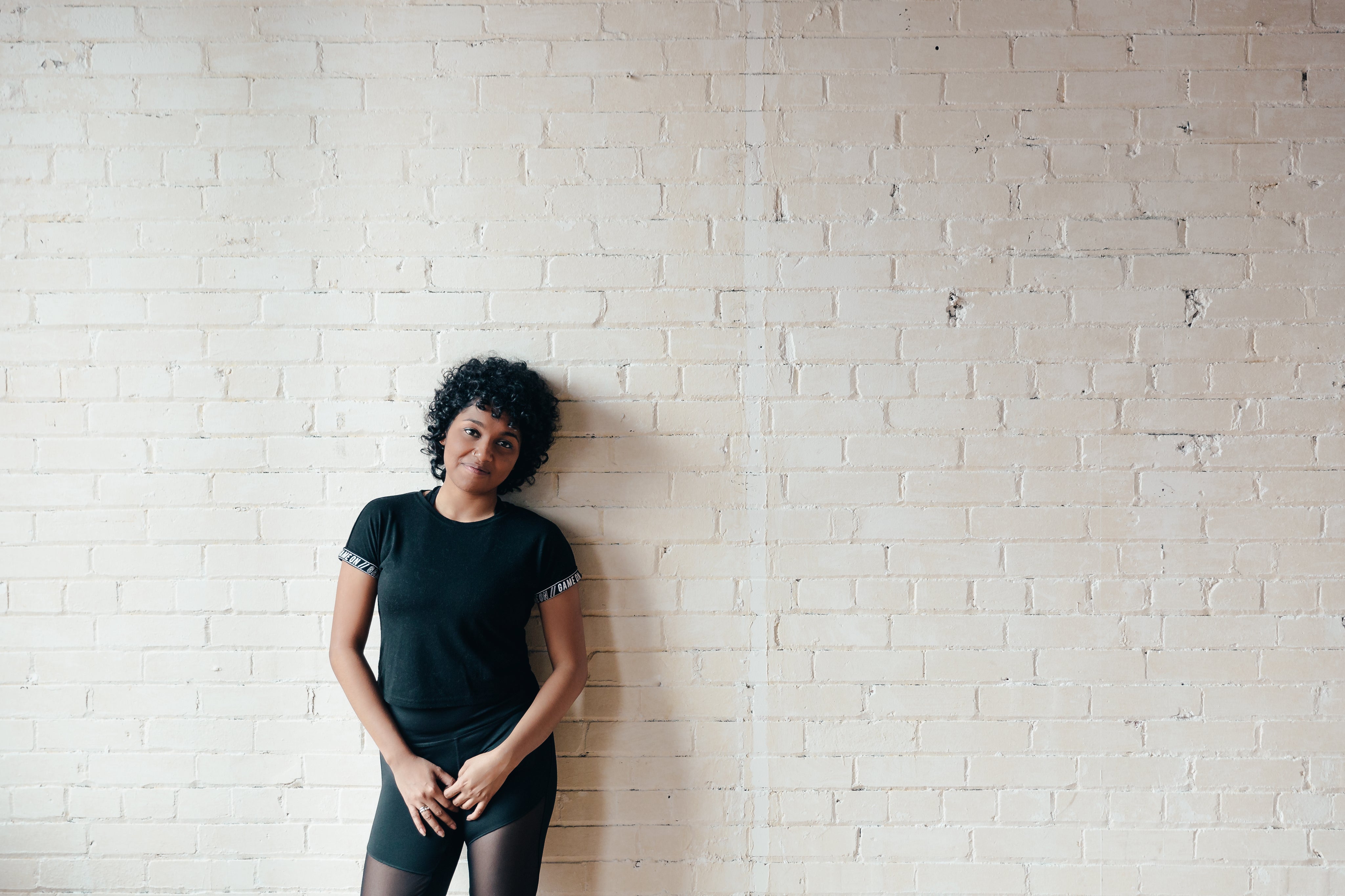 files/curly-haired-woman-bricks.jpg